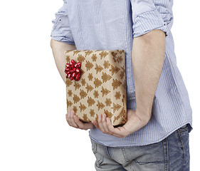 Image showing Young man holding a present