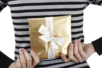 Image showing Young woman holding a present