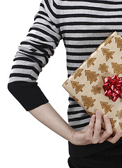 Image showing Young woman holding a present