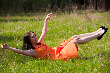 Image showing Pretty girl laying on grass