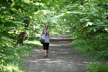 Image showing Girl walking in the woods