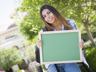 Image showing Excited Mixed Race Female Student Holding Blank Chalkboard