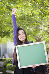 Image showing Excited Mixed Race Female Student Holding Blank Chalkboard