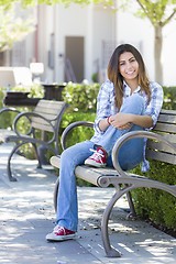 Image showing Mixed Race Female Student Portrait on School Campus Bench