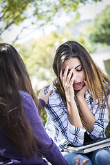 Image showing Stressed Sad Young Mixed Race Girl Being Comforted By Friend