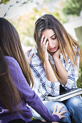 Image showing Stressed Sad Young Mixed Race Girl Being Comforted By Friend