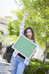 Image showing Excited Mixed Race Female Student Holding Blank Chalkboard