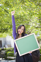 Image showing Excited Mixed Race Female Student Holding Blank Chalkboard