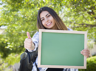 Image showing Excited Mixed Race Female Student Holding Blank Chalkboard