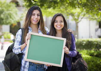 Image showing Mixed Race Female Students Holding Blank Chalkboard