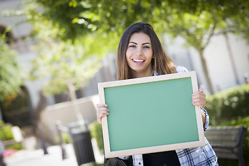 Image showing Excited Mixed Race Female Student Holding Blank Chalkboard