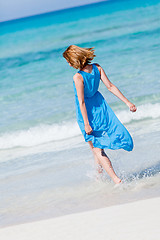 Image showing beautiful woman in blue dress on beach in summer