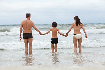 Image showing happy family ith two boys having fun in water summer holiday