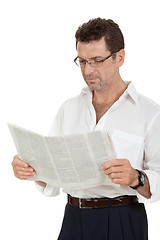 Image showing attractive adult businessman reading newspaper isolated