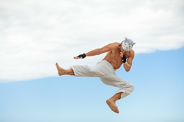 Image showing man is jumping sport karate martial arts fight kick