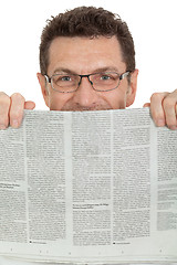 Image showing attractive adult businessman reading newspaper isolated