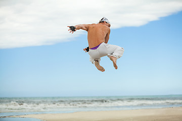 Image showing man is jumping sport karate martial arts fight kick