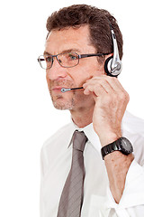 Image showing smiling mature male operator businessman with headset call senter