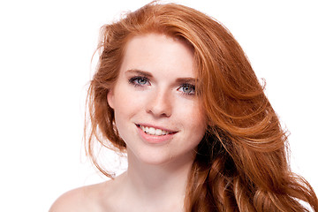 Image showing beautiful young smiling woman with red hair and freckles isolated