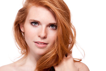 Image showing beautiful young smiling woman with red hair and freckles isolated