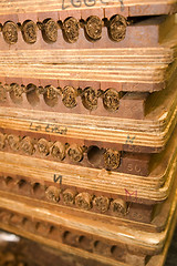 Image showing hand made cigars in press storage