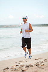 Image showing man is jogging on the beach summertime sport fitness