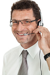 Image showing smiling mature male operator businessman with headset call senter