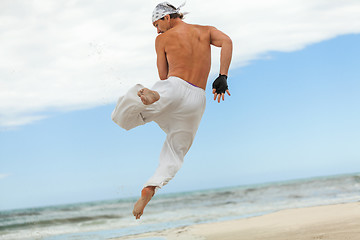 Image showing man is jumping sport karate martial arts fight kick