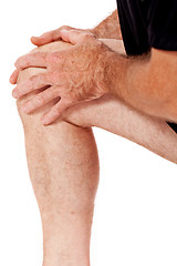 Image showing adult attractive man in sportswear knee pain injury ache isolated