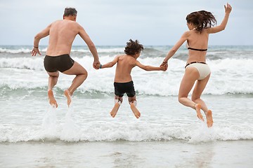 Image showing happy family ith two boys having fun in water summer holiday