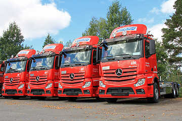 Image showing Four Red Mercedes-Benz Actros Trucks