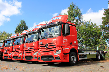 Image showing Row of Red Mercedes-Benz Actros Trucks