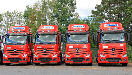 Image showing Row of Red Mercedes-Benz Actros Trucks