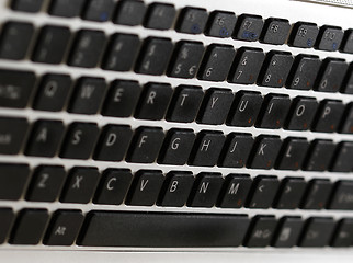 Image showing Young woman working on laptop