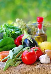 Image showing Fresh vegetables , olive oil and spices