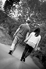 Image showing Couple Walking Down the Street