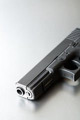 Image showing gun on brushed steel