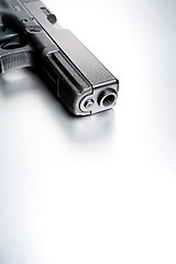 Image showing gun on brushed metal background