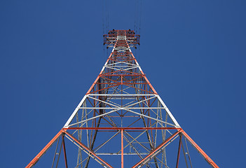 Image showing Red triangular power tower in the blue sky