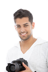 Image showing Young man with a dslr camera in his hands