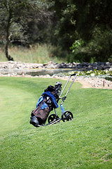 Image showing Golf bag and clubs on a golf course