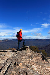 Image showing Hiker admiring mountain views