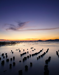 Image showing Sunset with sea and stone