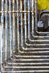 Image showing Many pipes on the wall