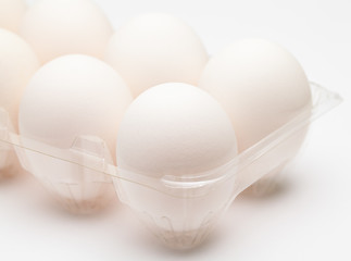 Image showing White egg in transparent container