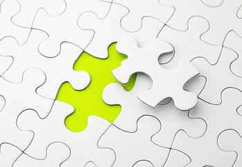 Image showing Puzzle with missing piece in green color