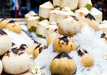 Image showing Young coconut on food stall