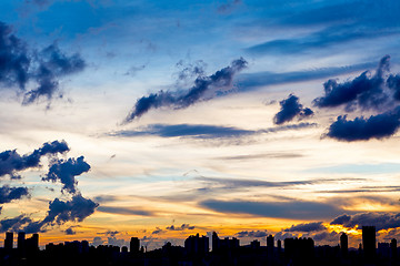 Image showing City skyline silhouetted against a blue sunset