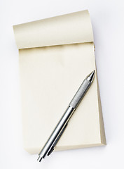 Image showing Blank memo pad with pen