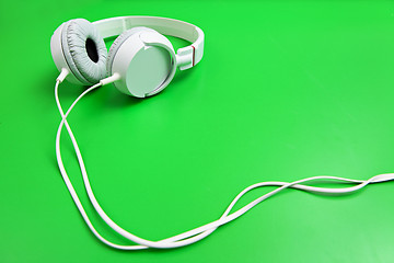 Image showing Headphone on green background